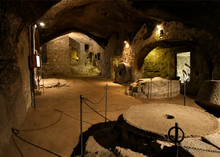 Ancient olive mill and millstones preserved at Orvieto Underground